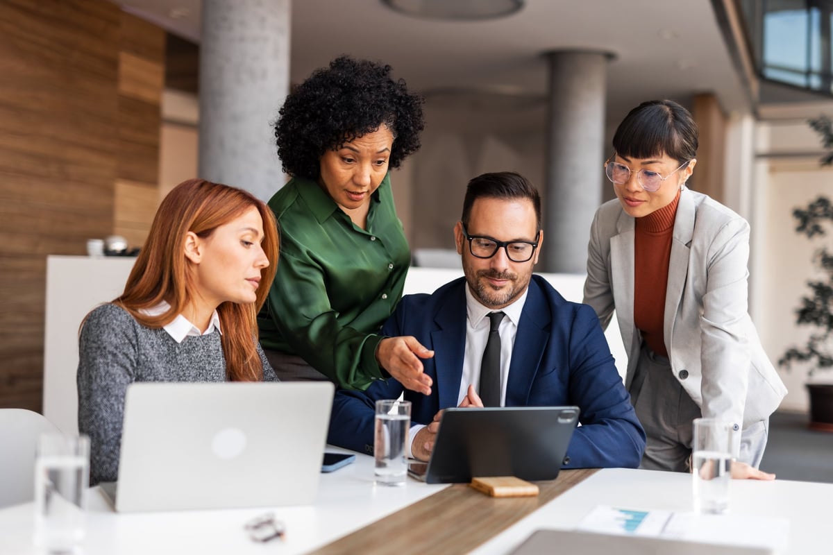 Professional team collaborating with modern technology